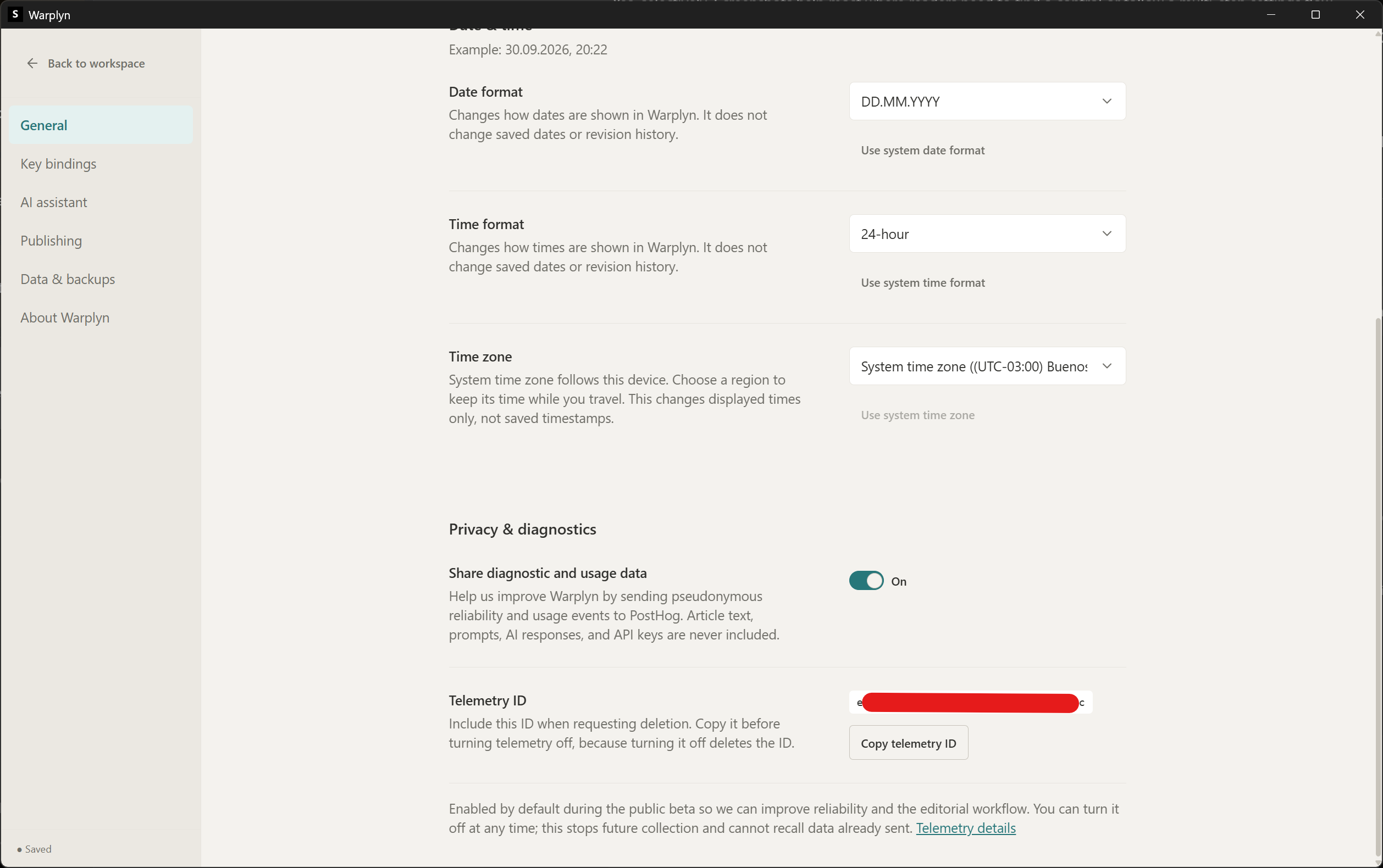Privacy and diagnostics settings showing the sharing toggle and Telemetry ID controls with the ID obscured.
